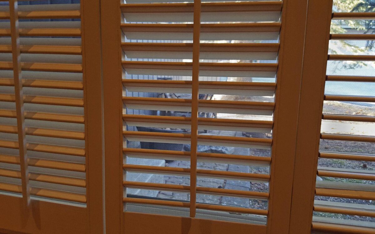 Indoor Wooden Shutters With Mesh Screen And Outdoors